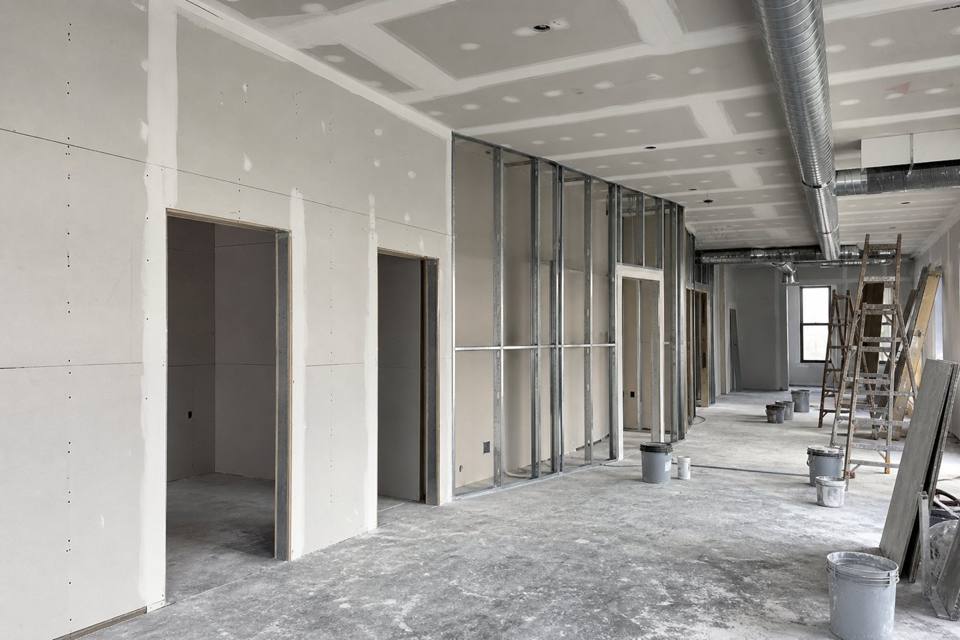 Commercial drywall buildout with metal studs and hung sheetrock in Brevard County